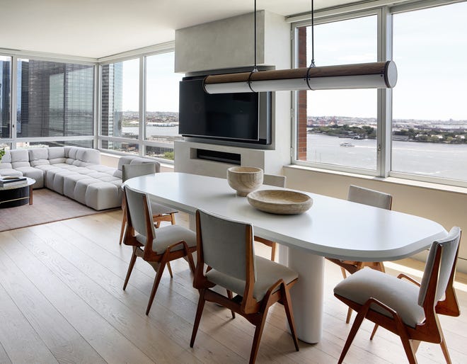 The bright, modern dining room takes advantage of  the harbor view.
