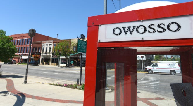 An out-of-order, coin-operated phone booth in downtown Owosso, Tuesday, June 2, 2020. Karl Manke keeps his Owosso barbershop open even though Governor Gretchen Whitmer ordered nonessential businesses to close during the COVID-19 lockdown.