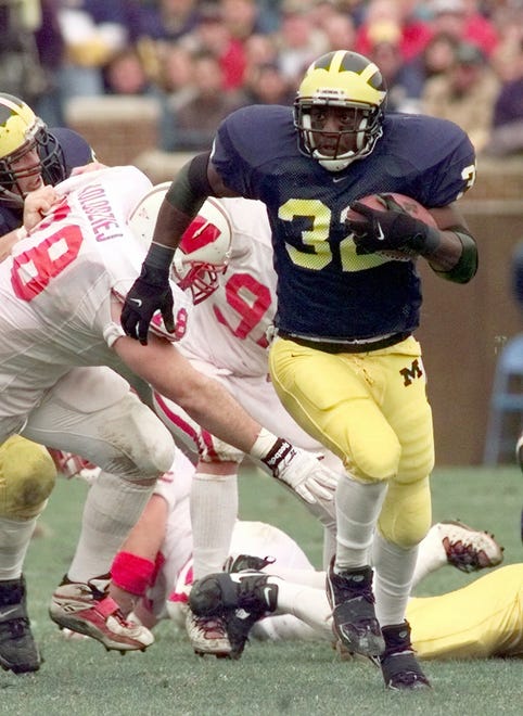 RUNNING BACK – Anthony Thomas, 1997-2000: The “A Train” was a powerful runner who became Michigan’s all-time leading rusher in 2000 with 4,472 yards, a record that would be broken by Hart. He is now third behind Hart and quarterback Denard Robinson (4,495). He has Michigan’s record for rushing touchdowns with 55 and also a UM record of six games of 150 yards or more rushing.