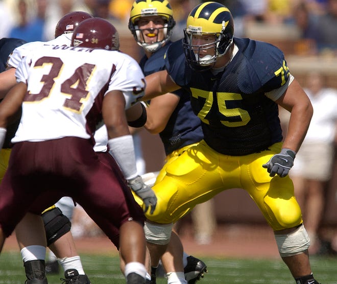 OFFENSIVE LINE – David Baas, 2001-04: Not only was Baas the Big Ten Offensive Lineman of the Year in 2004, he also was named the nation’s best center and was awarded the Rimington Trophy. Baas was a three-time All-Big Ten first-team selection and also was an All-American in 2004.