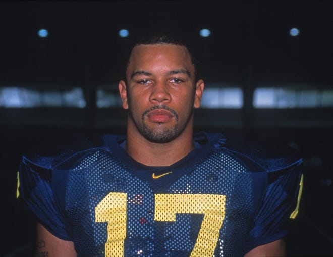 LINEBACKER – Larry Foote, 1998-2001: Foote was first team All-Big Ten in 2000 and 2001. In his last season, Foote was Big Ten Defensive Player of the Year and an All-American. He held the record for most tackles for loss in a game with seven against Iowa in 2001, but the record was broken in 2017 by Khaleke Hudson (eight against Minnesota).
