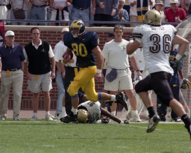 TIGHT END – Jerame Tuman, 1995-98: Maybe you remember Tuman best for being on the receiving end of Michigan’s 1997 bread-and-butter play-action bootleg that worked time and again. Tuman holds the program record for tight ends in career receiving touchdowns with 15 – in 1996 and 1997 he had five touchdowns each season. He is third in career receptions by a tight end with 98 and was All-Big Ten his final three seasons.