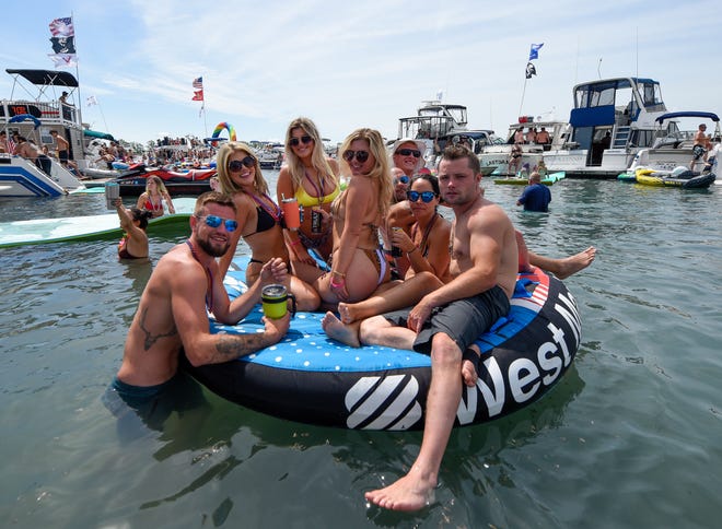 Partygoers have fun during the annual Jobbie Nooner at Gull Island on Lake St. Clair, Friday, June 26, 2020.