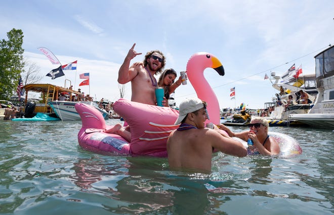 Partygoers enjoy the festivities during the annual Jobbie Nooner at Gull Island on Lake St. Clair, Friday, June 26, 2020.