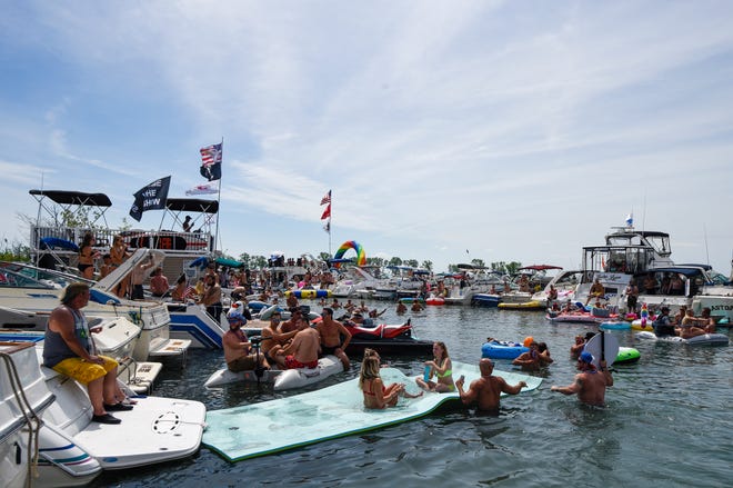 Partygoers have fun during the annual Jobbie Nooner at Gull Island on Lake St. Clair, Friday, June 26, 2020.