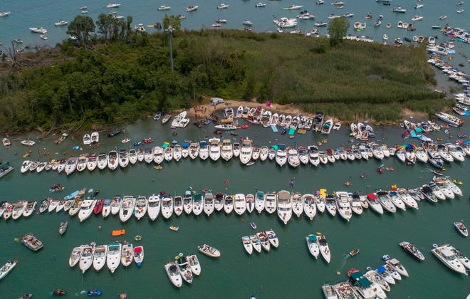 Boaters raft off at the annual Jobbie Nooner at Gull Island on Lake St. Clair, Friday, June 26, 2020.