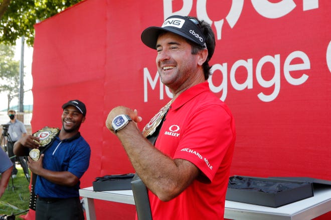 Bubba Watson and Harold Varner III, left, show off the winner's belts after their exhibition victory against Jason Day and Wesley Bryan.
