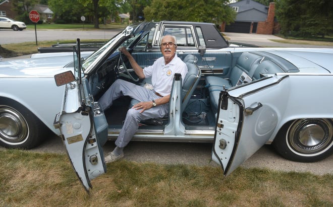 Anthony Maria, of Beverly Hills,  shows off the suicide doors on his 1965 Lincoln Continental convertible, August 12, 2016.