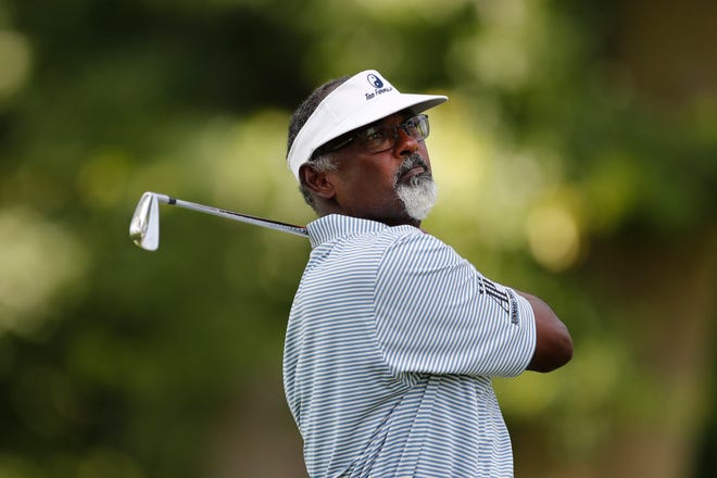 Vijay Singh watches his drive on the 11th tee.