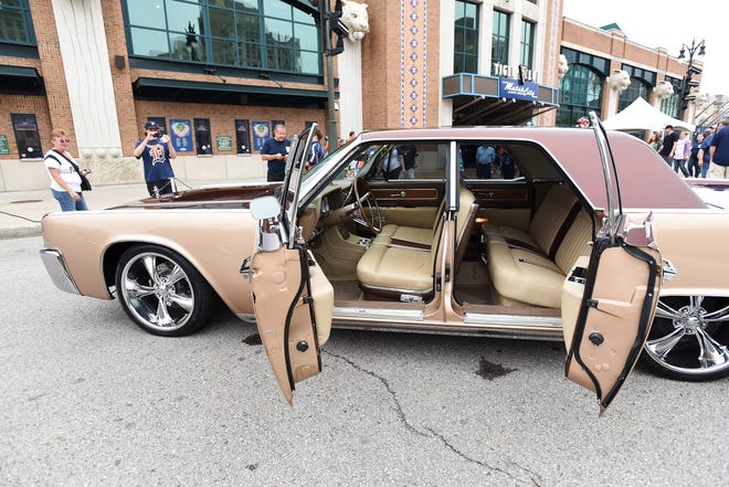 A 1963 Lincoln Continental, featuring suicide doors and owned by Robert Young of Royal Oak, is on display at a Classic Car Show before a Detroit Tigers game at Comerica Park, in Detroit, June 13, 2015.