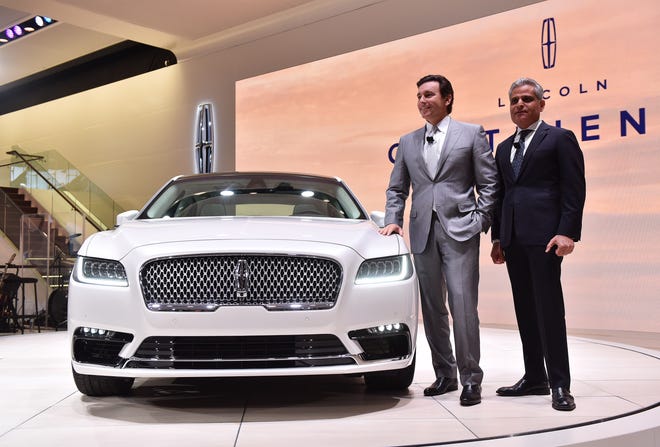 Ford Motor Company president and CEO Mark Fields, left, and Lincoln president and vice president Kumar Galhotra with the all new Lincoln Continental after the Lincoln press conference at the North American International Auto Show at Cobo Center in Detroit on Jan. 12, 2016.  The car was introduced as a concept at the 2015 New York Auto Show.