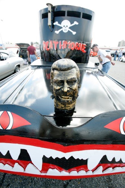 A 1966 Lincoln Continental modified to look like the Deathmobile from the movie Animal House on display at the Woodward Dream Cruise at 13 Mile and Woodward, in Royal Oak, August 14, 2008. .  It took the owner, Matt Henry, of Lake Orion, over three months to modify the car.