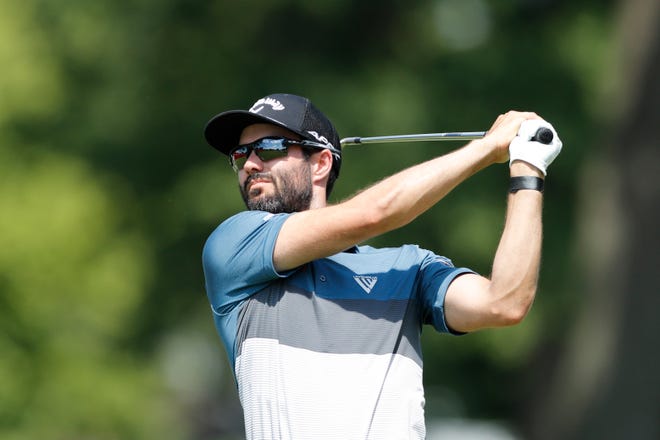Adam Hadwin hits from the 15th tee during the first round of the Rocket Mortgage Classic.