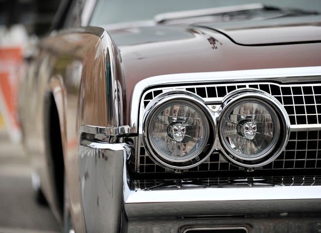 Customized skull headlights on a 1963 Lincoln Continental owned by Robert Young, of Royal Oak, are on display at a Classic Car Show before a Detroit Tigers game at Comerica Park, in Detroit, June 13, 2015.