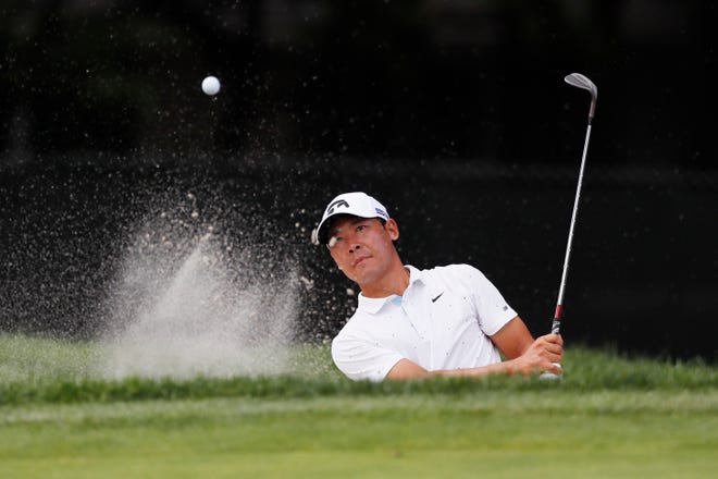 Xinjun Zhang of China hits onto the ninth green during the second round of the Rocket Mortgage Classic golf tournament, Friday, July 3, 2020, at the Detroit Golf Club in Detroit.