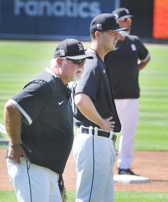 Tigers manager Ron Gardenhire works with his players.