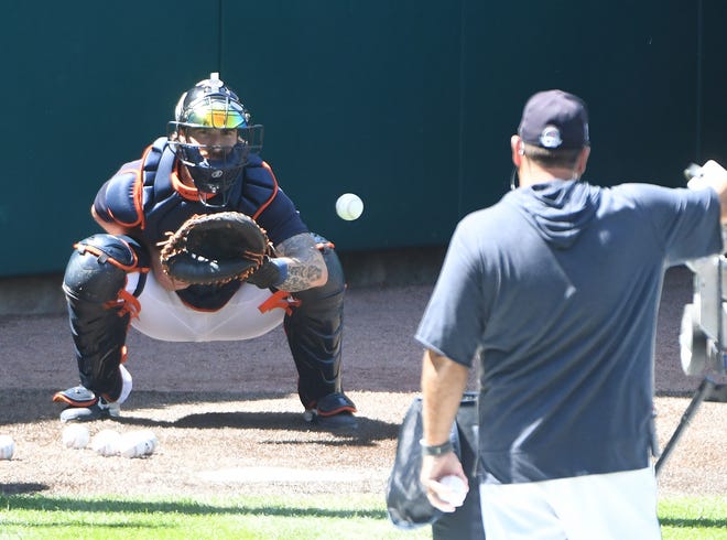 Catcher Eric Haase works during Tigers training camp.