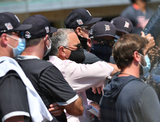 Tigers general manager and executive vice president, baseball operations Al Avila, in pink, and others watch live batting practice. Detroit Tigers work out at Comerica Park in Detroit on July 6, 2020.