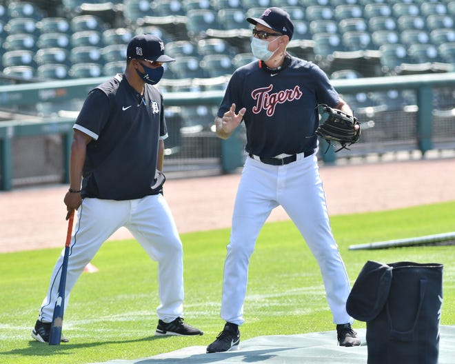Tigers special assistant to the manager Alan Trammell, right, talks with third base coach Ramon Santiago.  Detroit Tigers work out at Comerica Park in Detroit on July 6, 2020.