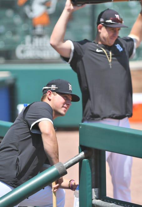Tigers No. 1 draft pick Spencer Torkelson, left, and Frank Schwindel watch as the previous group wraps up living batting practice.  Detroit Tigers work out at Comerica Park in Detroit on July 6, 2020.