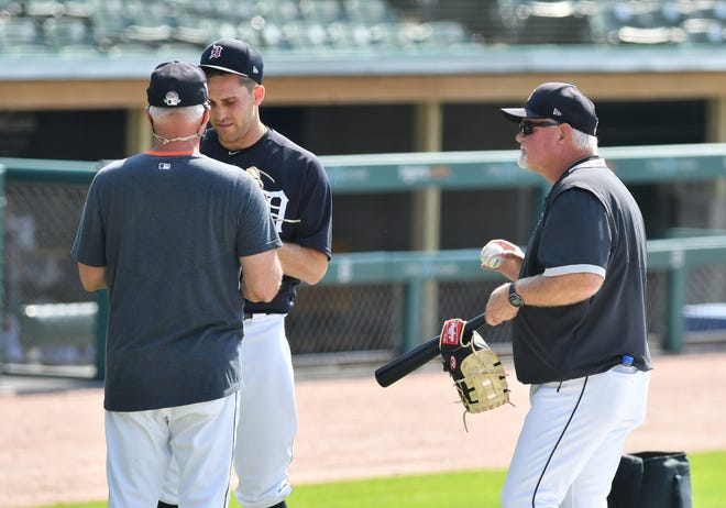 From left, Tigers pitching coach Rick Anderson talks with pitcher Matthew Boyd while manager Ron Gardenhire looks on.  Detroit Tigers work out at Comerica Park in Detroit on July 6, 2020.
