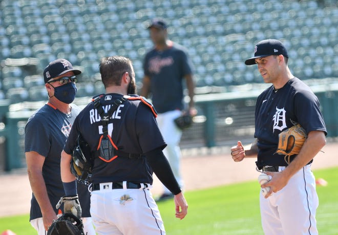 From left, Tigers pitching coach Rick Anderson, catcher Austin Romine and pitcher Matthew Boyd talk after Boyd threw live batting practice.  Detroit Tigers work out at Comerica Park in Detroit on July 6, 2020.
