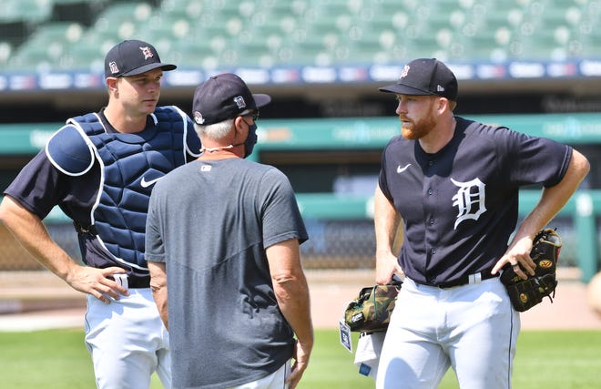 From left, Tigers catcher Grayson Greiner, pitching coach Rick Anderson and pitcher Spencer Turnbull talk after a live batting session.  Detroit Tigers work out at Comerica Park in Detroit on July 6, 2020.