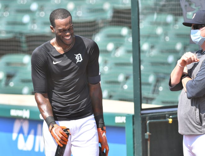 Tigers outfielder Cameron Maybin laughs between his turns batting.  Detroit Tigers work out at Comerica Park in Detroit on July 6, 2020.