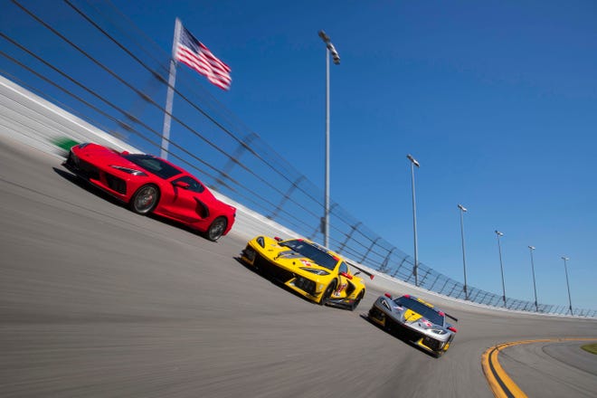 The production Corvette C8 (red, left) with the C8.R race car on the banking at Daytona International Speedway in Daytona Beach, Florida.