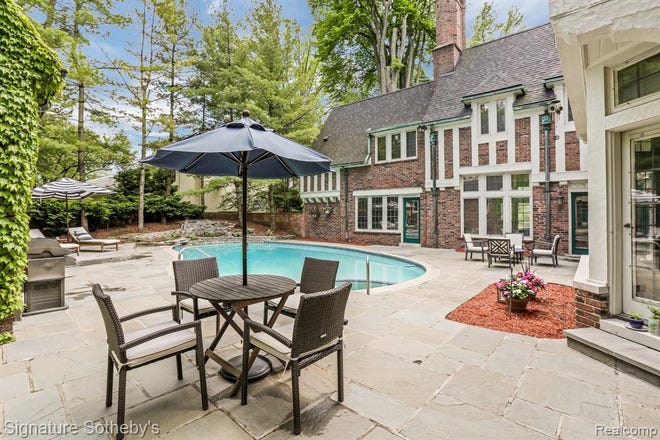 Home centers around a completely private outdoor area with pool, hot tub and new bluestone patio.