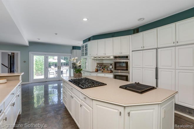 Kitchen opens to large family room for modern, open concept living.