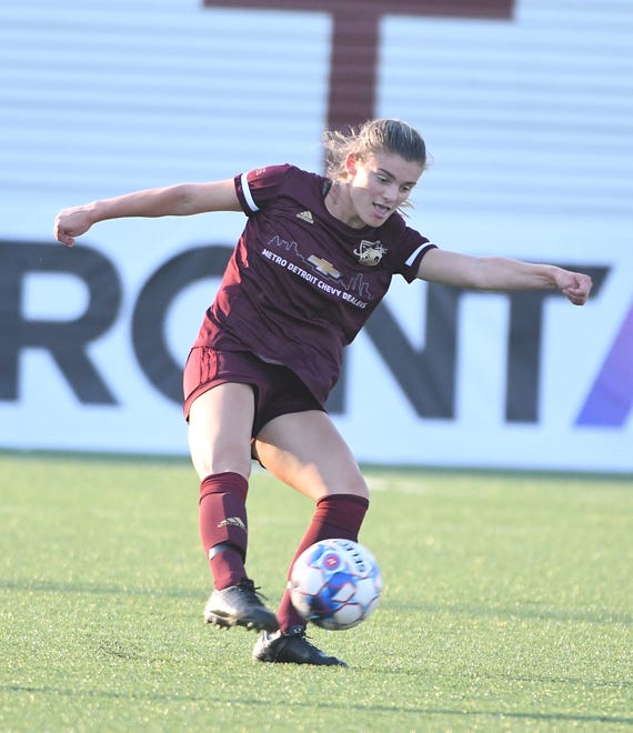 Detroit City FC's Bri Rogers boots the ball back upfield in the first half.