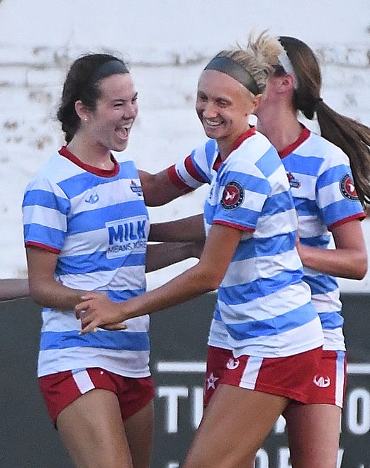 Lansing United's Rachel Philpotts celebrates with teammates after her goal tied up the game 1-1 in the second half.