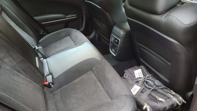 The rear seats of the 2020 Dodge Charger Scat Pack Plus have plenty of room for long legs and briefcases.