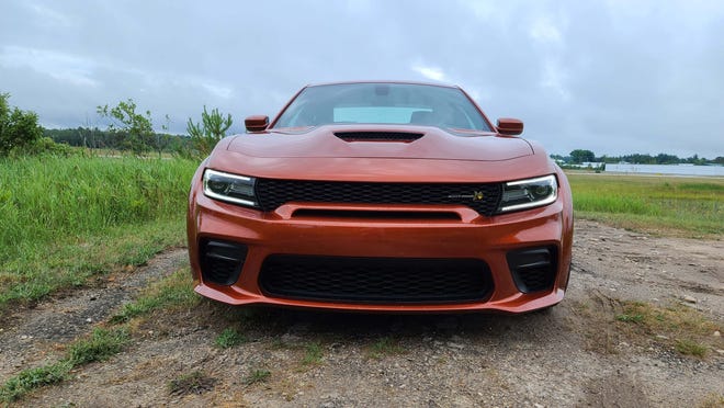Hood scoop, menacing LED running lights, big air intakes. Yup, that's the 2020 Dodge Charger Scat Pack Plus coming hard behind you.