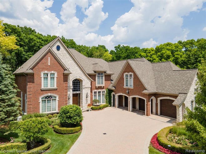 A Tuscan estate in Washington Township designed with over 12,000 square feet of living space features dramatic ceilings, hardwood and marble floors, motorized chandeliers, extra large windows, and custom artist details throughout.