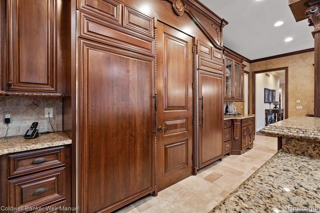 Tuscan designed chef's kitchen with granite and high-end appliances and cabinetry.