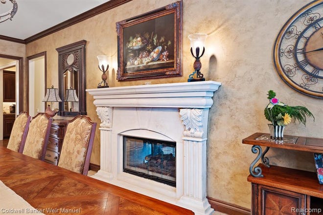 A fireplace in this dining area off the kitchen.