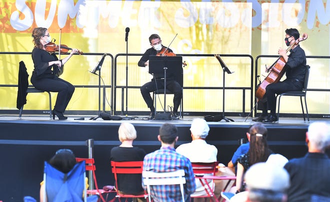 Detroit Symphony Orchestra kicks off Outdoor Performance Series with a string trio of Kimberly Kaloyanides Kennedy on violin, Eric Nowlin on viola and Wei Yu on cello at Sosnick Courtyard in Detroit, Michigan on August 5, 2020.