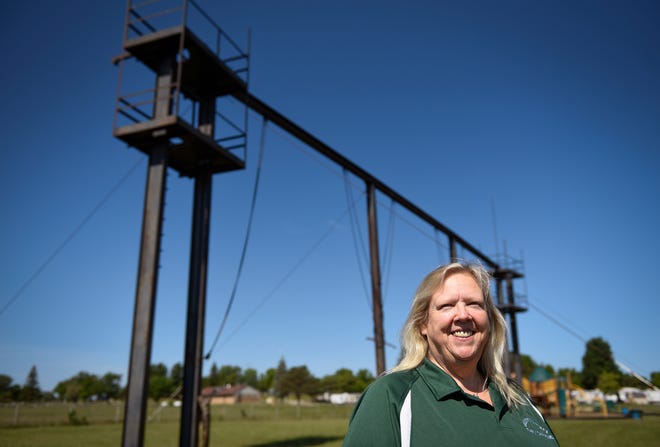Sharon Kinchsular, CEO at Greenwood Acres Family Campground in Jackson, Michigan, stands near the still-remaining light and sound support systems, Wednesday, August 5, 2020. The property was the site of the Goose Lake International Music Festival August 7-9, 1970.