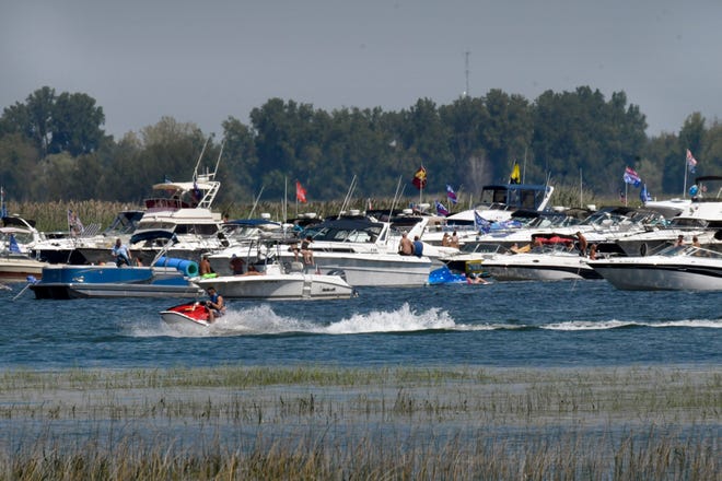 Boaters enjoy the festivities of the annual Raft Off, located on Little Muscamoot Bay.