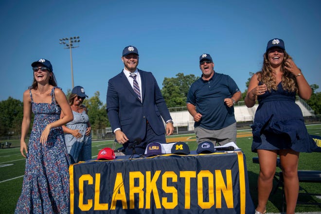 From left, Dominique Spindler, Rochelle Spindler, Rocco Spindler, Marc Spindler and Isabella Spindler celebrate Rocco’s commitment to Notre Dame during Rocco’s college decision choice at Clarkston High School in Clarkston on Aug. 8, 2020.