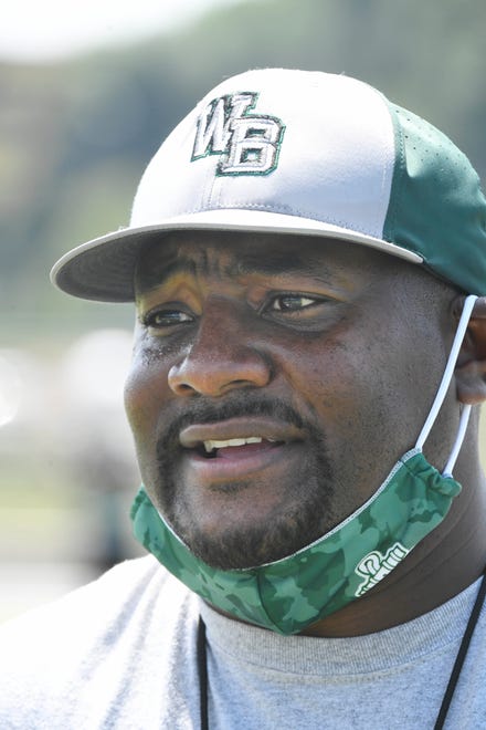 West Bloomfield football coach Ron Bellamy looks on during practice Monday.