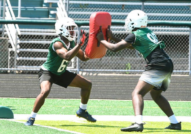West Bloomfield High running back Donovan Edwards works against Deandre Hill during drills.