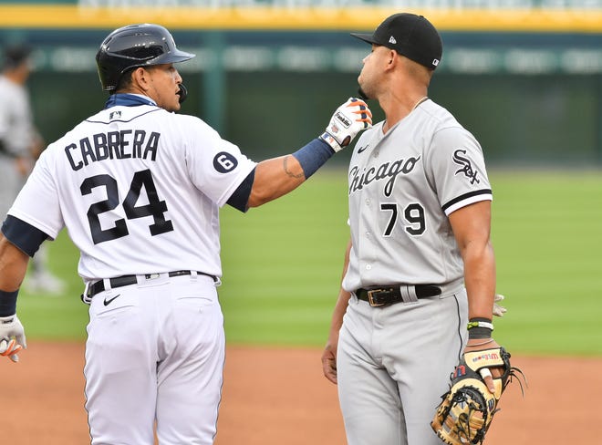 Tigers designate hitter Miguel Cabrera tugs on the facial hair of White Sox first baseman Jose Abreu in the first inning.