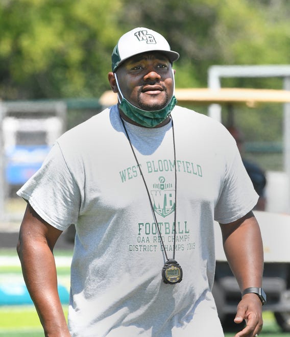 Coach Ron Bellamy looks on during West Bloomfield  football practice.