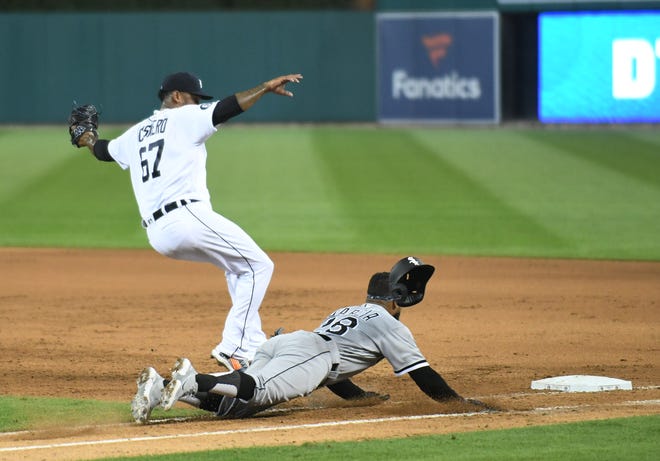 Chicago's Leury Garcia reaches first base before Tigers pitcher Jose Cisnero in the seventh inning.  Detroit Tigers vs Chicago White Sox at Comerica Park in Detroit on Aug. 10, 2020.