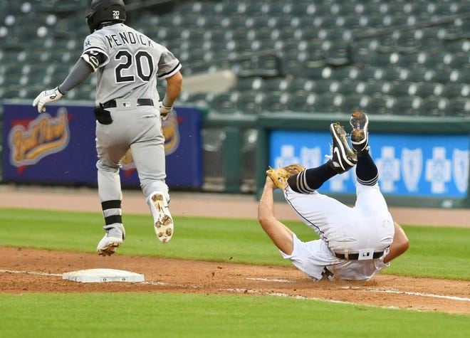 Tigers pitcher Daniel Norris somersaults after he gets the out at on Chicago's Danny Mendick (20) at first base in the fourth inning.