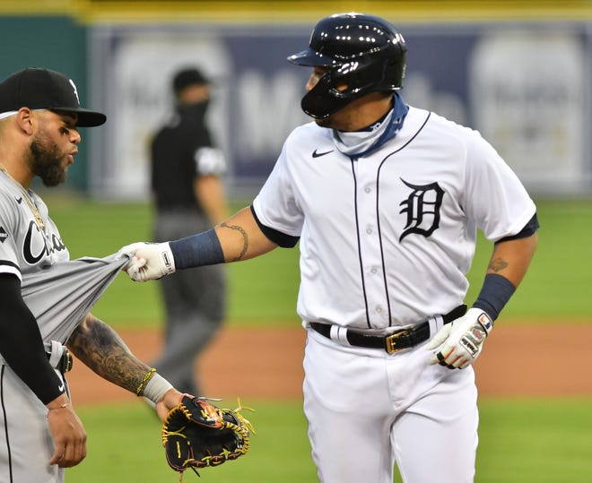 Tigers designated hitter Miguel Cabrera pulls on the jersey of White Sox third baseman Yoan Moncada in the fourth inning.  Detroit Tigers vs Chicago White Sox at Comerica Park in Detroit on Aug. 10, 2020.