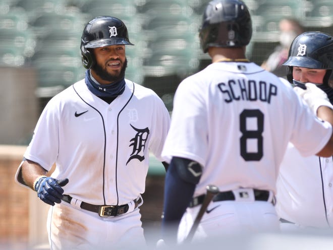 The Tigers' Jonathan Schoop (8) congratulates Willi Castro after Castro's two-run, go-ahead home run in the fourth inning made it 5-3.